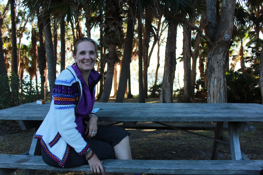 Mountain climber Candice Coghlan sitting at a bench at the Women's Adventure Summit hosted in Forster, NSW.