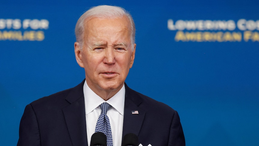 Close up of President Joe Biden speaking at a lectern.