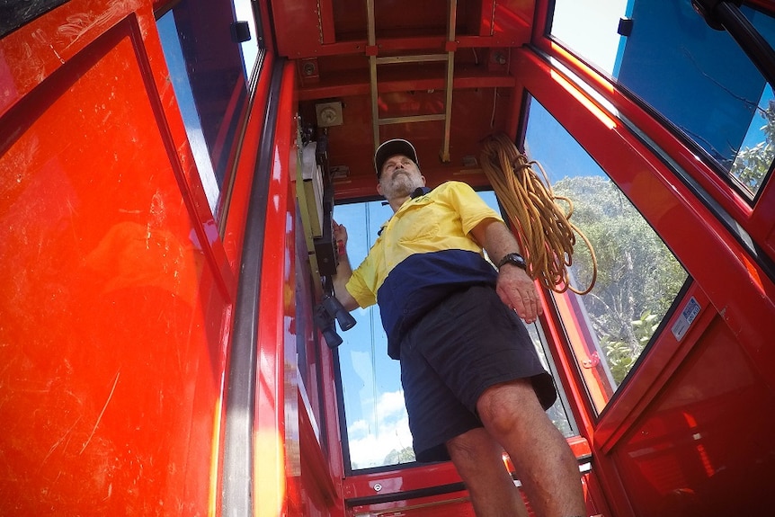 Shot looking up at Spiro while he operates the cable car