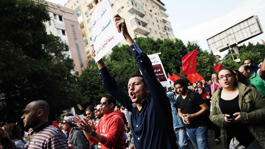 Egyptian demonstrators march towards Cairo's Tahrir Square in protest against Mohamed Morsi.