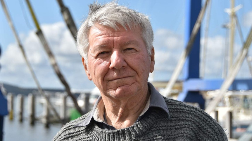 Headshot of Prof Peter Cook standing on a jetty.