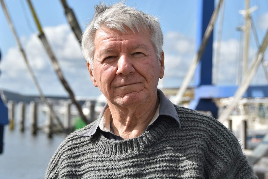 Headshot of Prof Peter Cook standing on a jetty.