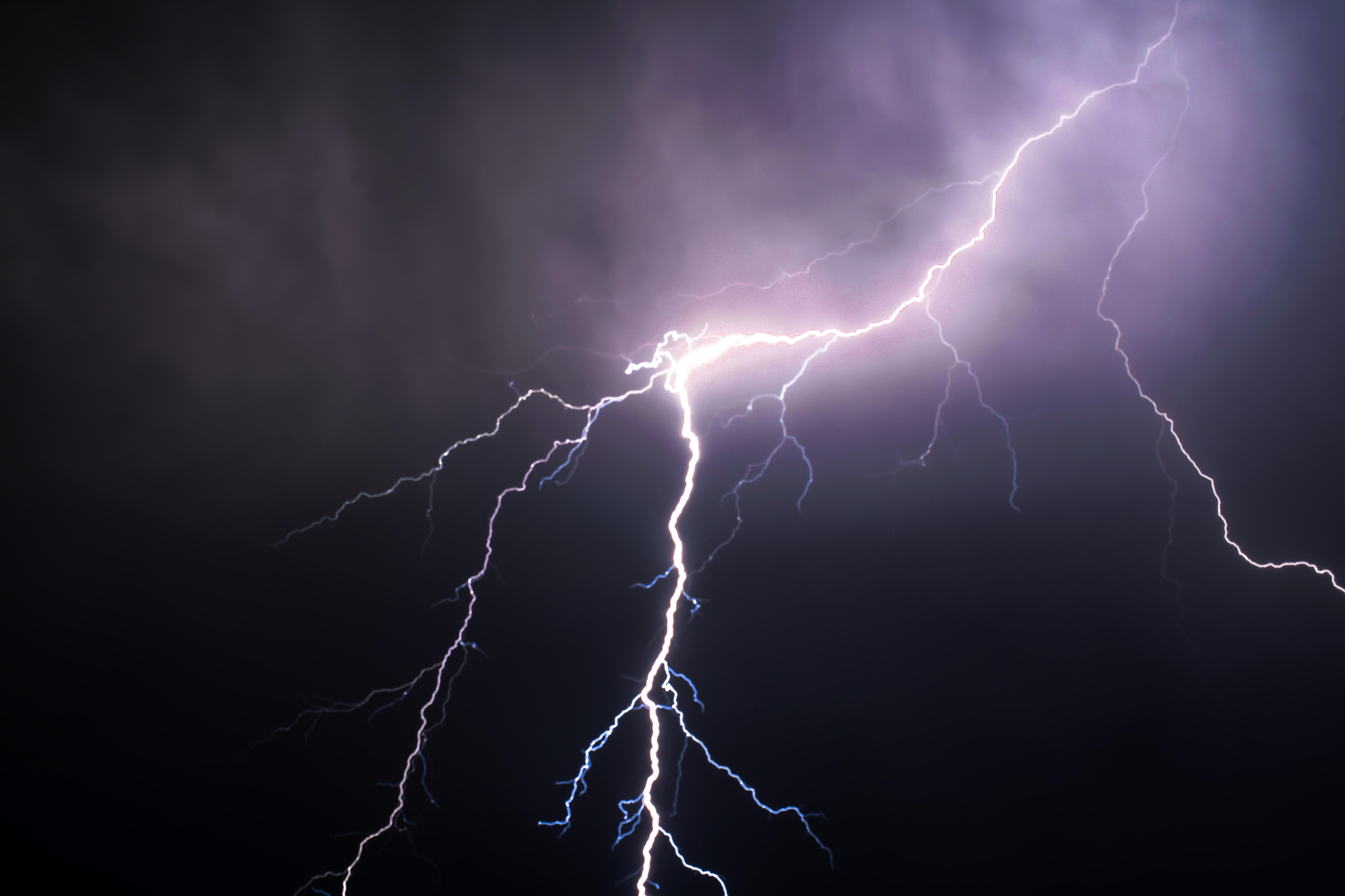 Lightning in the night sky, with the text "Severe Storm"