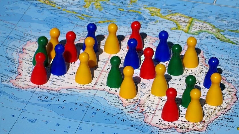 Map of Australia with colourful board game pieces scattered over it - illustrating population