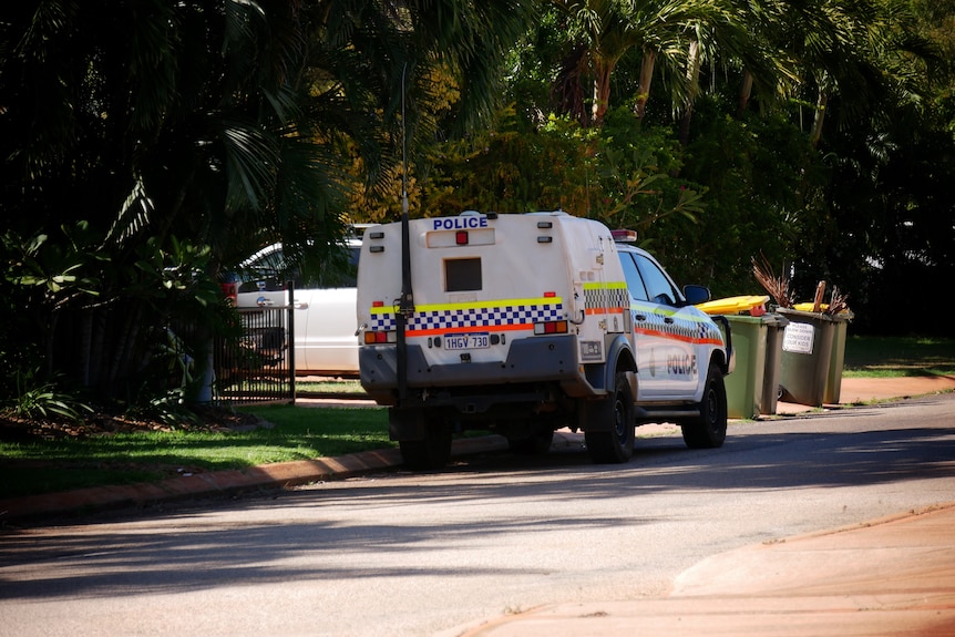 A police car parked outside a home on Friday morning. 