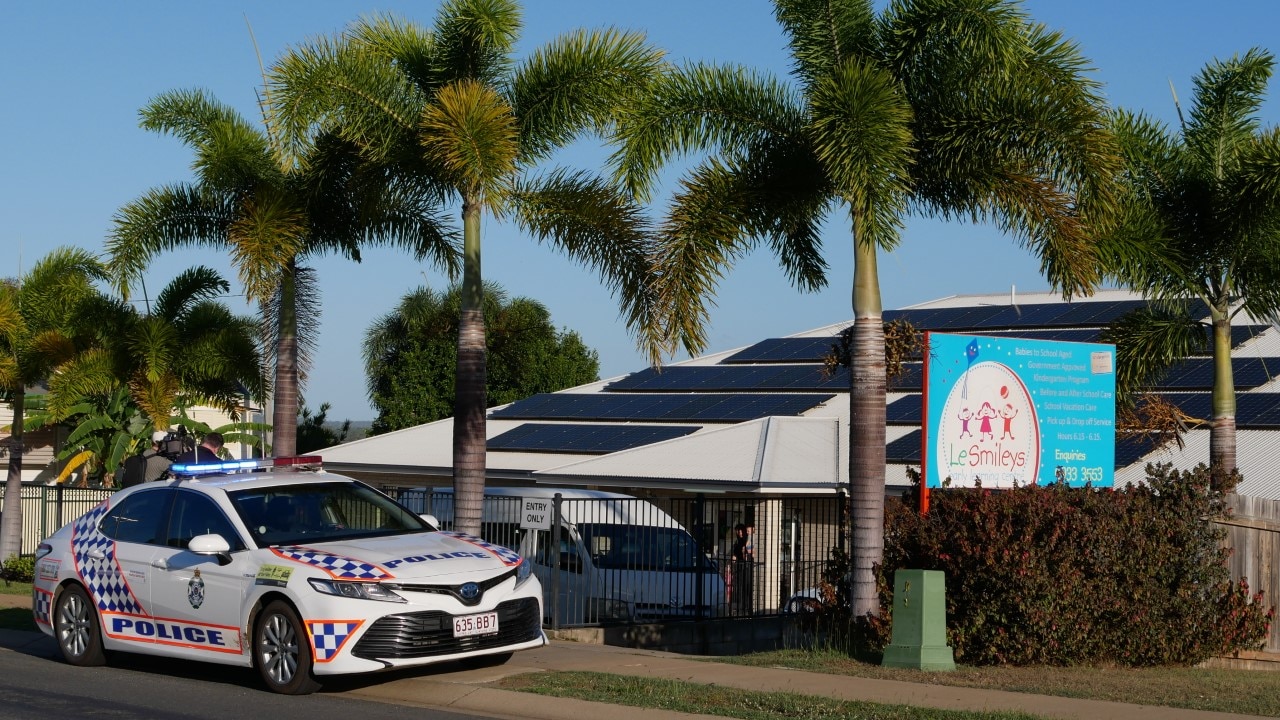 Police care outside daycare.