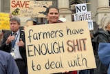 woman holding protest sign 