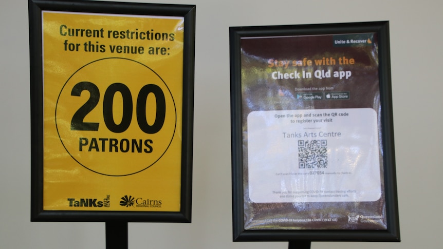 a sign showing 200 patrons and a COVID QR code check in