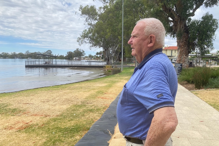 A man looking over a river