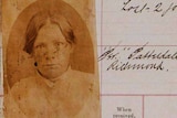 An old sepia-tone mugshot of a woman.