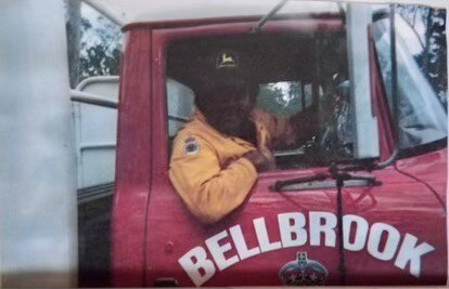 An Aboriginal man sitting in a fire truck.