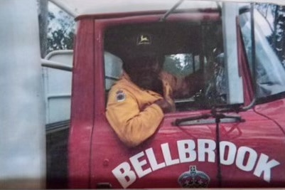 An Aboriginal man sitting in a fire truck.