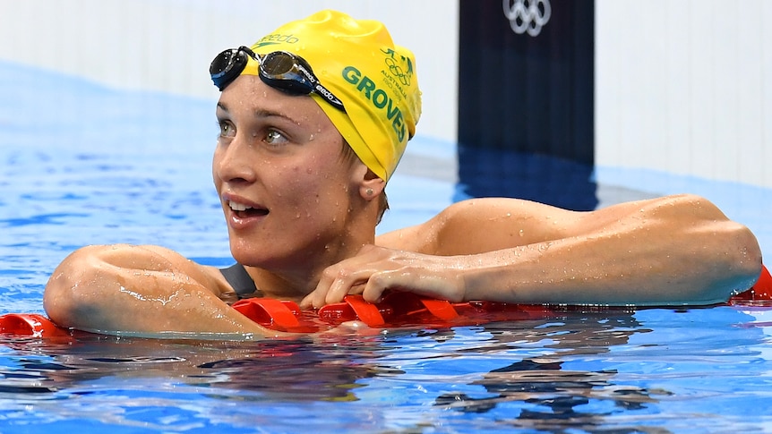 An Australian female swimmer leans on a lane rope at the 2016 Rio Olympics.