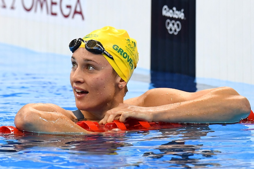 An Australian female swimmer leans on a lane rope at the 2016 Rio Olympics.