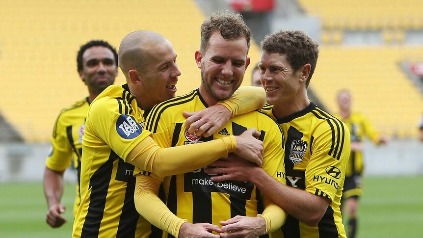 Wellington players congratulate Jeremy Brockie after his goal against the Wanderers.