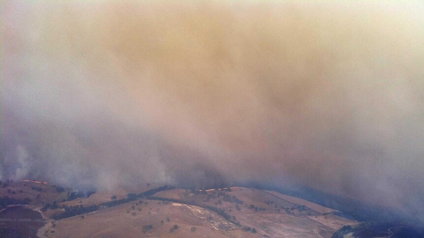 A cloud of smoke rises from a bushfire at Glenmaggie.