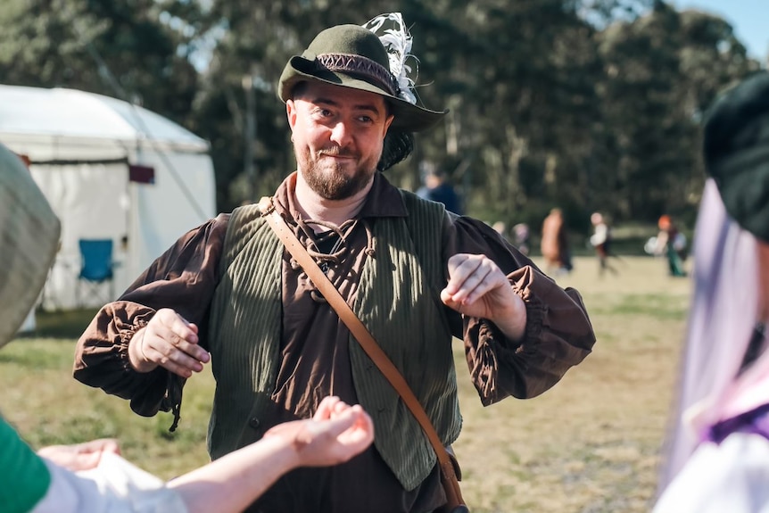 A man dressed in a Robin Hood-style costume. 
