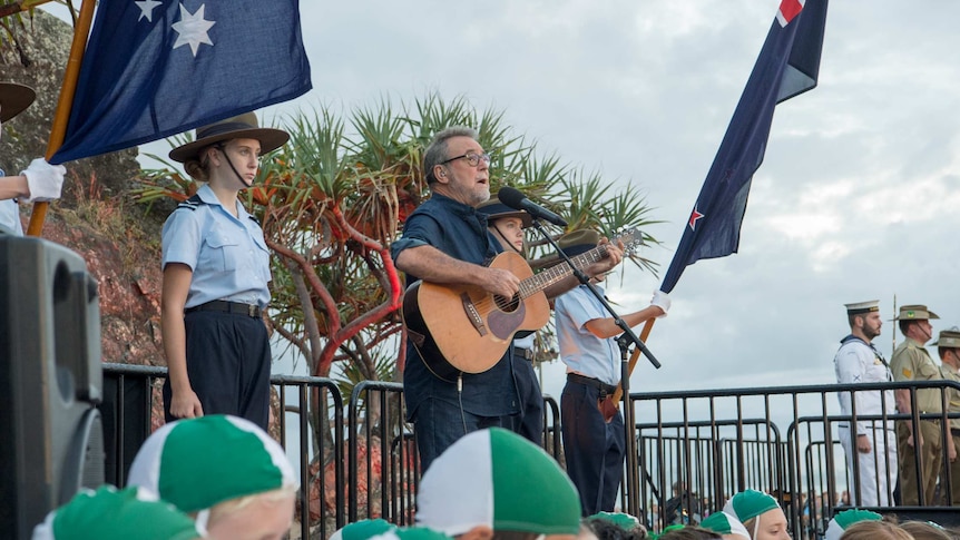 Singer John Williamson performing at ANZAC Day service on Currumbin Beach