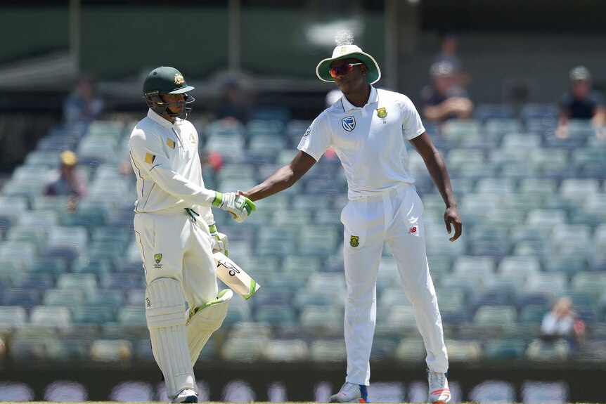 South Africa's Kagiso Rabada shakes the hand of dismissed Australian batsman Usman Khawaja