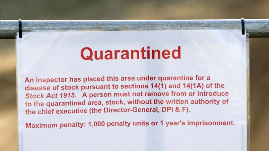 A quarantine sign sits at the entrance to a property at Cawarral