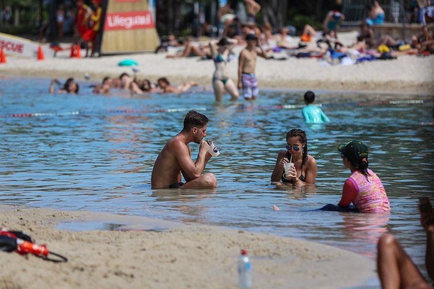 People swimming at South Bank in Brisbane during the heatwave.