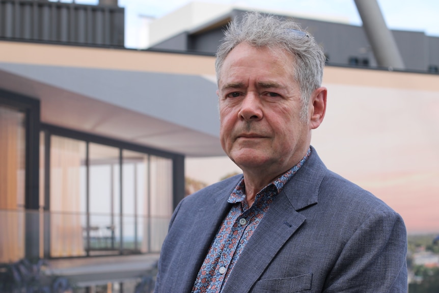 portrait shot of Simon Wheeler with development in the background