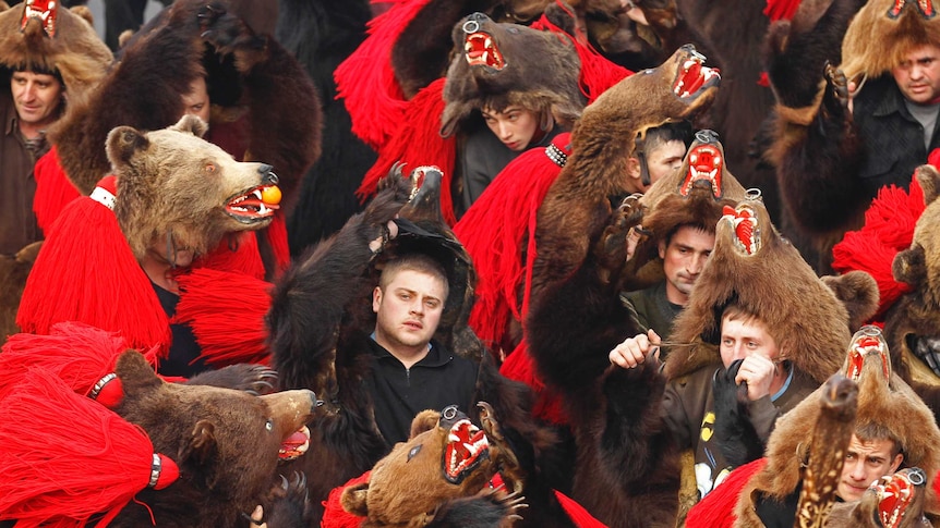 Dancers from Romania's Moldova perform the "bear" dance