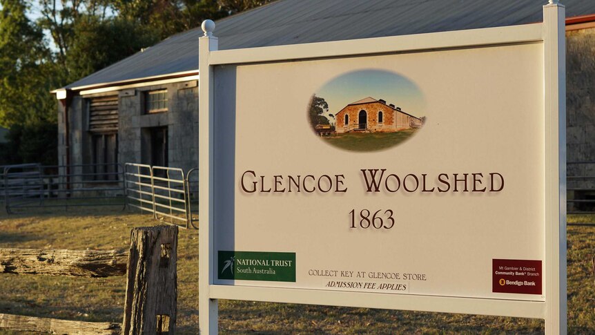 A sign reads "Glencoe Woolshed, 1863" out the front of the brick building.