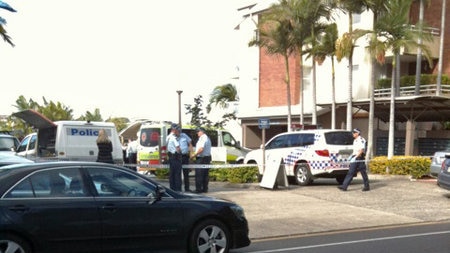 Police out the front of Mercantile Place apartments in Newstead after yesterday's fatal shooting.