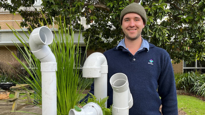 Bryce Watts-Parker behind a frog hotel.