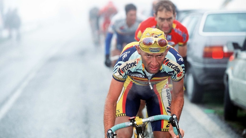 Marco Pantani rides in the mist