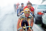 Marco Pantani rides in the mist
