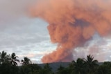 Manaro volcano on Ambae island in Vanuatu with red smoke coming out.