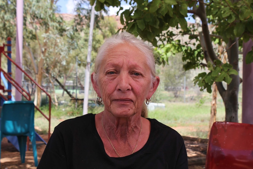 Gamilaroi woman Hazel Collins wearing a Grandmothers Against Removals t-shirt in Alice Springs.