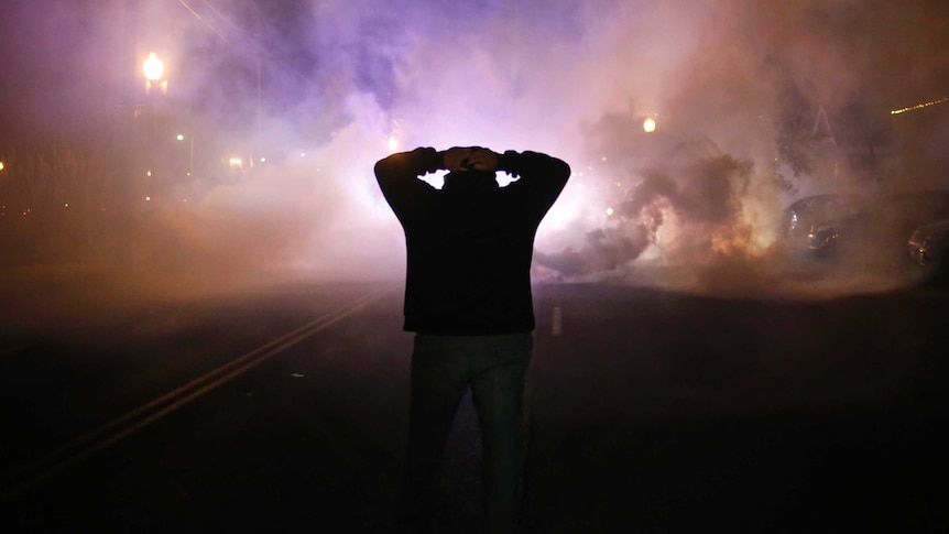Ferguson protester surrounded by tear gas