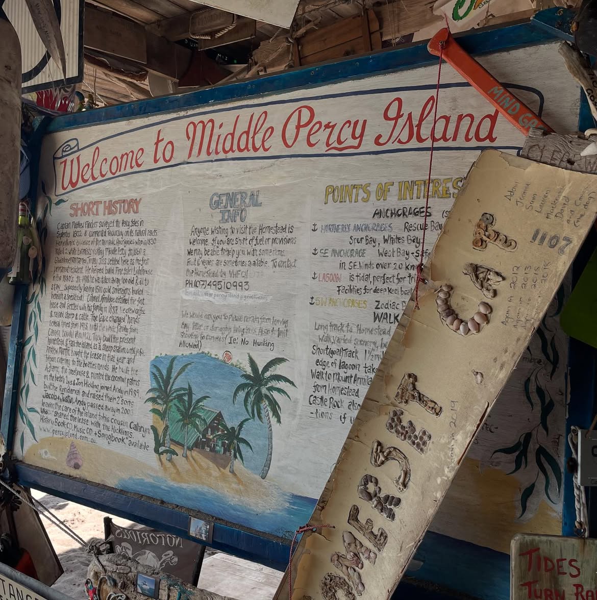 A hand-painted sign with history and information about Middle Percy sits inside the A-frame.