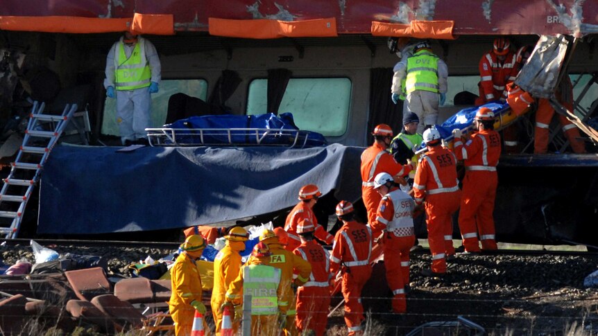 Emergency service workers remove bodies from a V/Line train