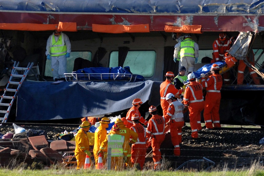 Emergency service workers remove bodies from a V/Line train