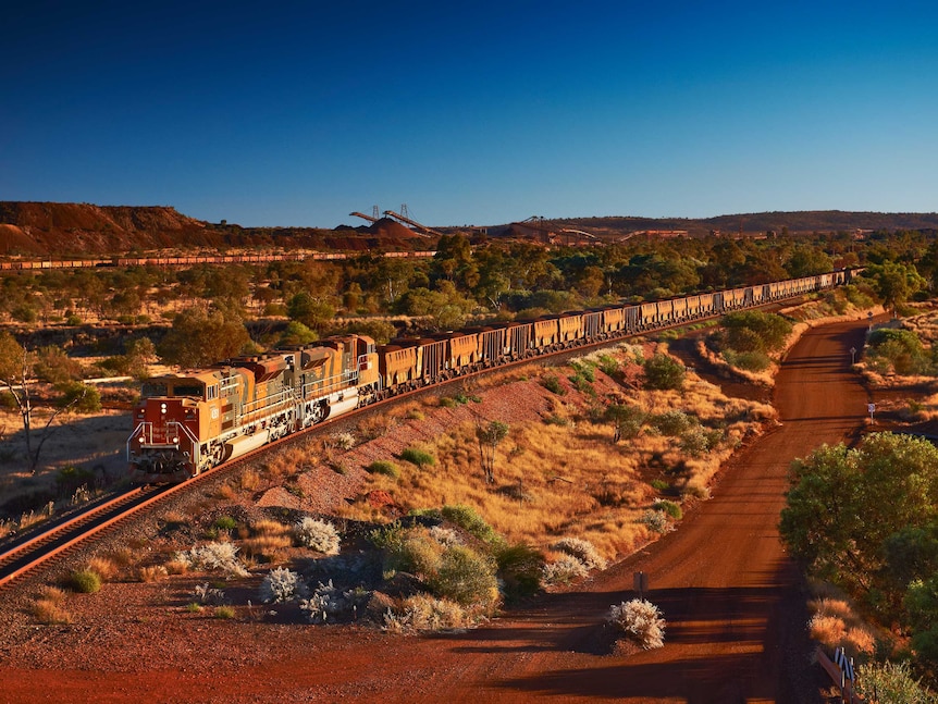 An iron freight train on BHP's Mt Newman Mine line in Pilbara, WA.