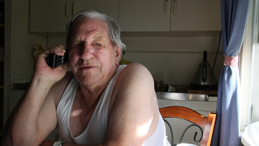 WA pensioner John Boyce on his telephone