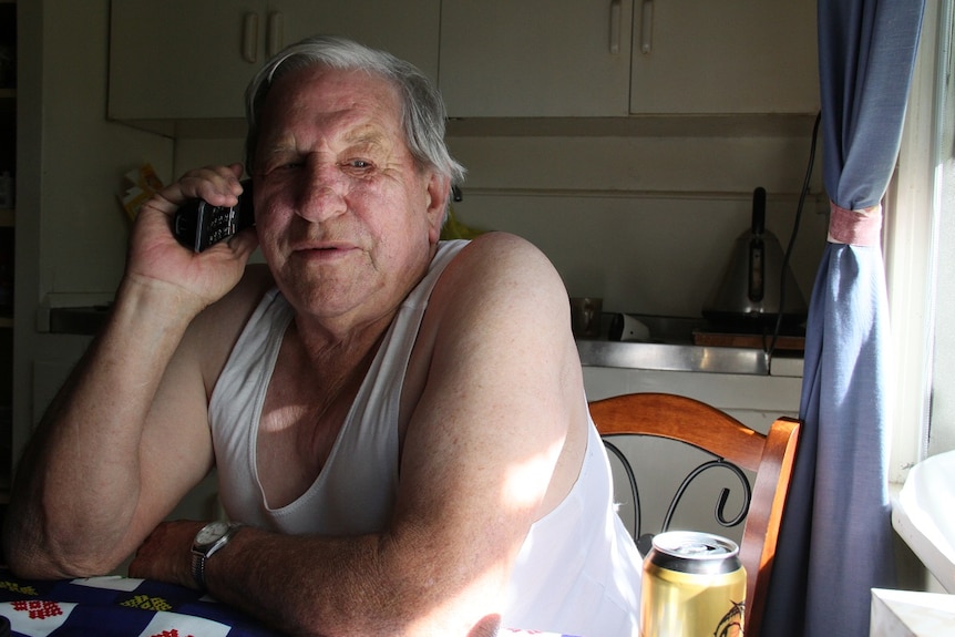 WA pensioner John Boyce on his telephone