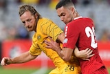 Rhyan Grant competes for possession against Bassel Jradi during a friendly match between Australia and Lebanon