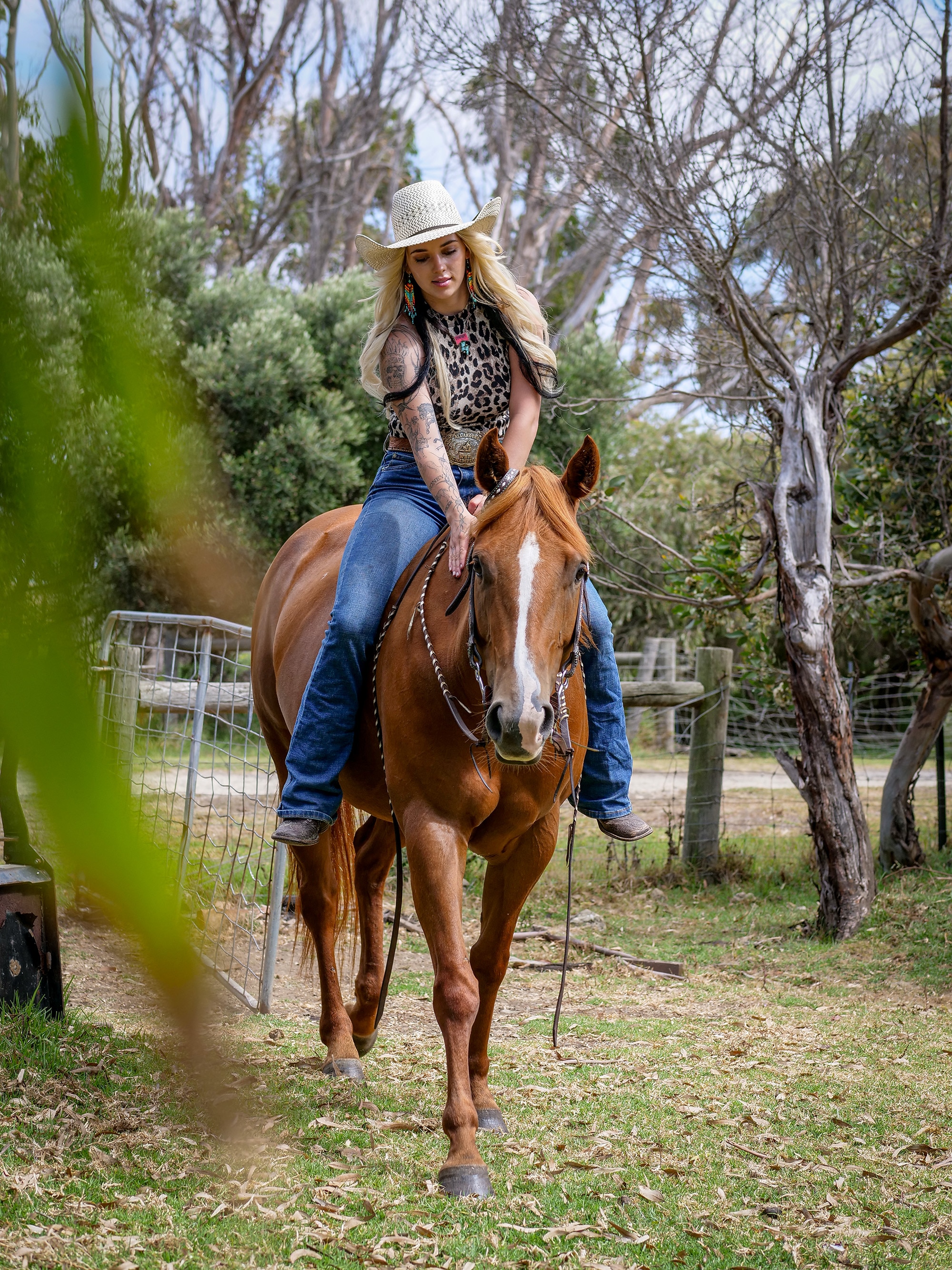 A woman riding a horse