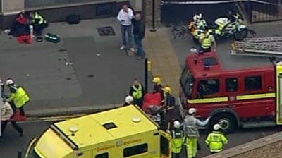 Emergency crews gather as blasts rattle the Underground in London.