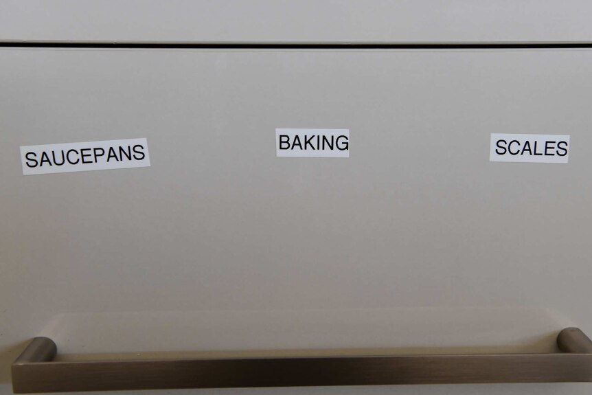 Karen Cooke has put labels on her drawers in her kitchen to help her memory.