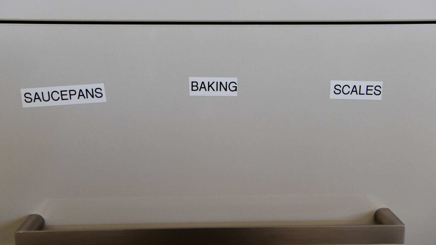 Karen Cooke has put labels on her drawers in her kitchen to help her memory.
