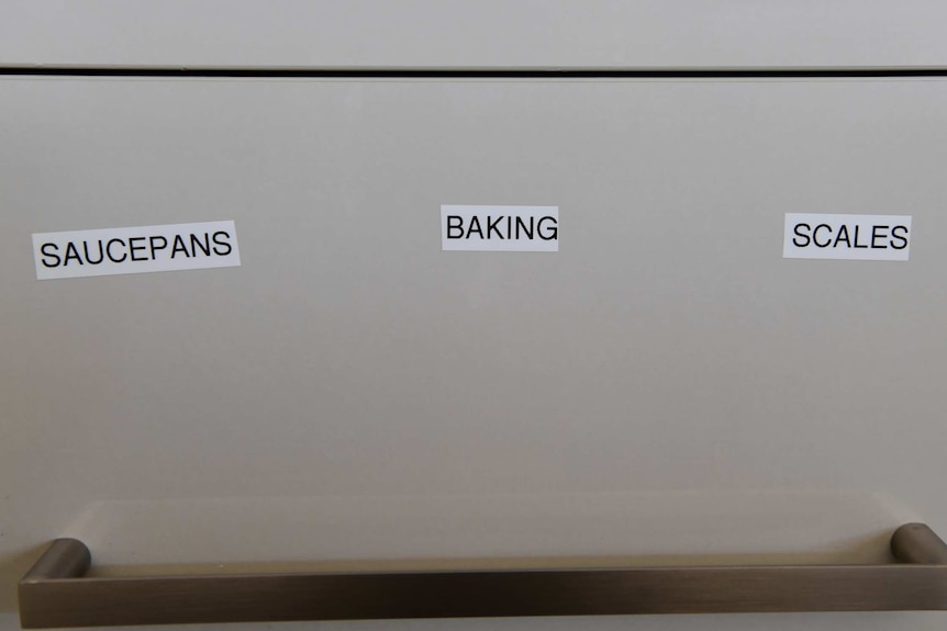 Karen Cooke has put labels on her drawers in her kitchen to help her memory.