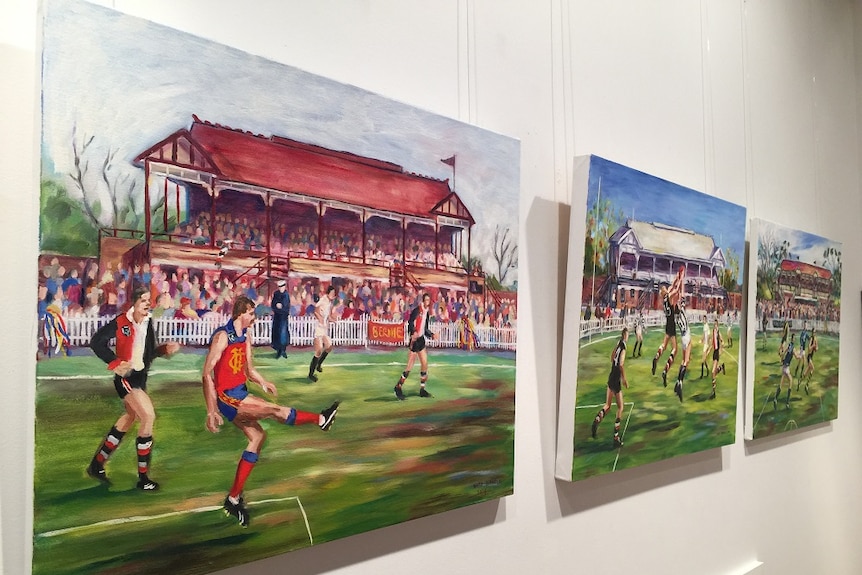 Three paintings showing football games being played at suburban Melbourne grounds.