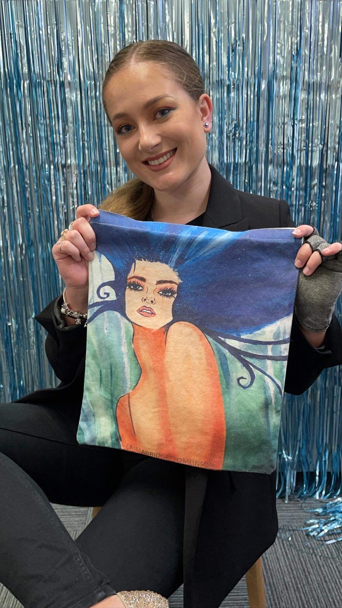 Girl holding tote bag.