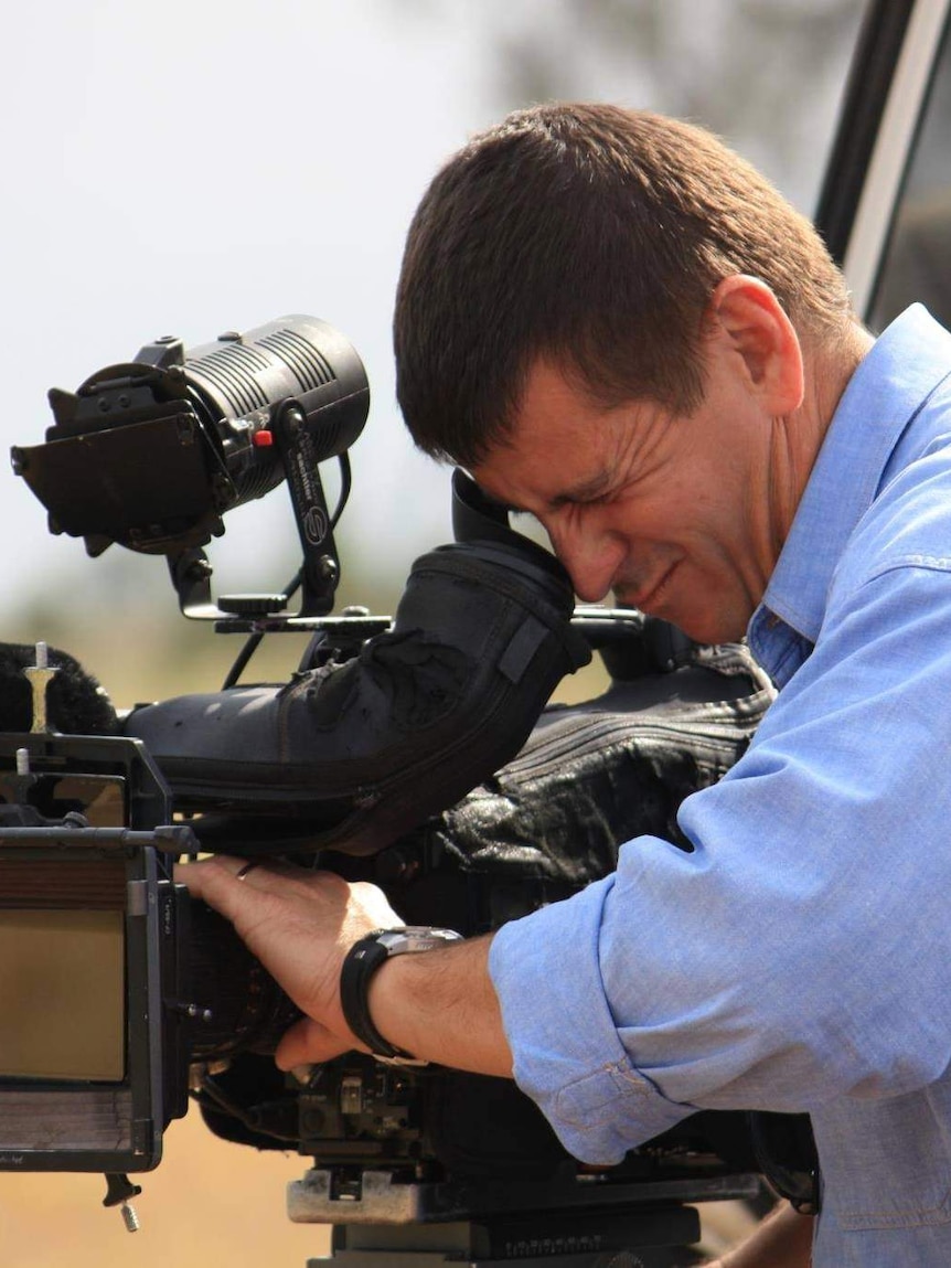 ABC cameraman John Bean looks down the lens.
